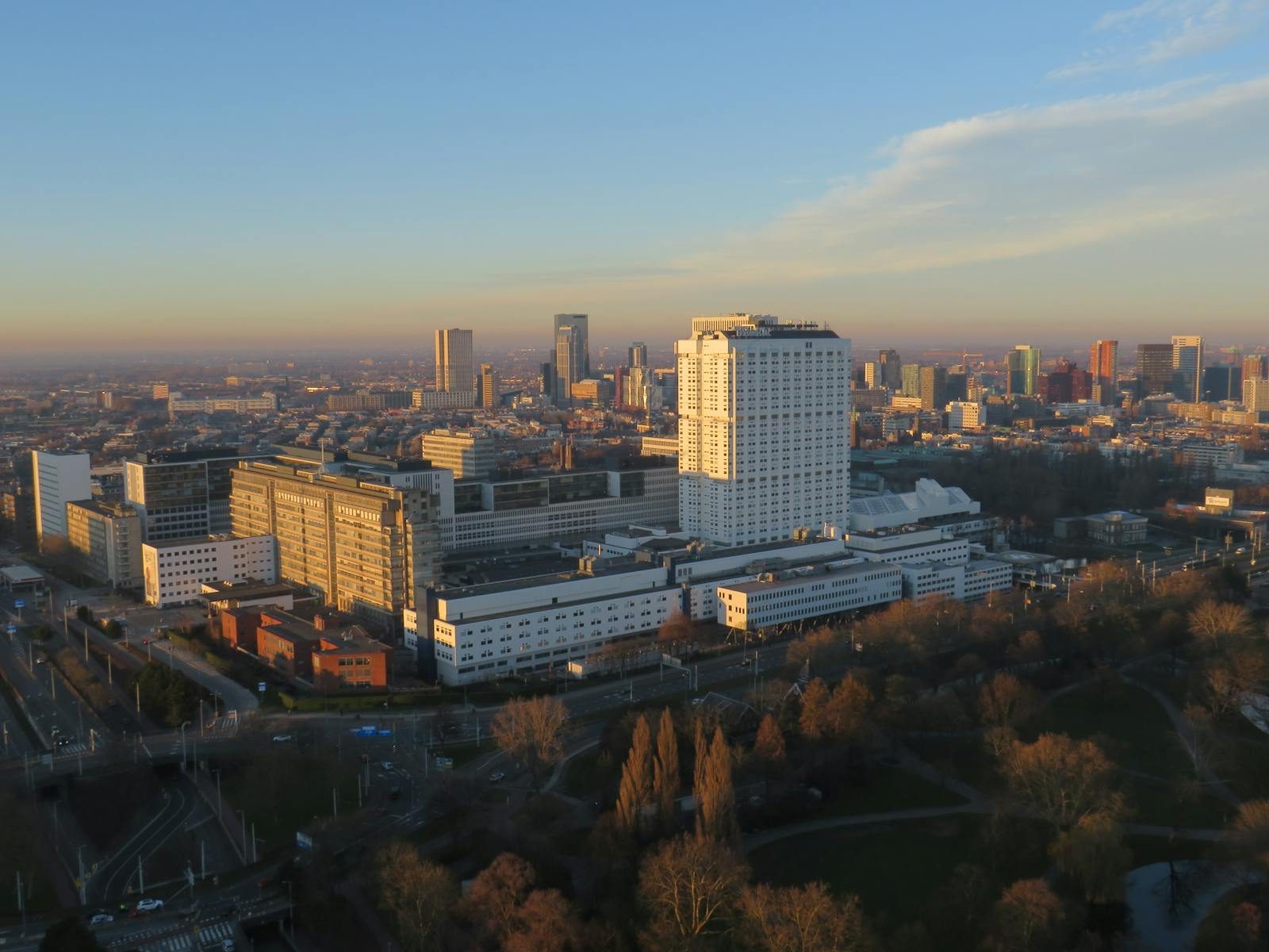 Captivating aerial view of Rotterdam skyline showcasing modern architecture and cityscape at sunrise.